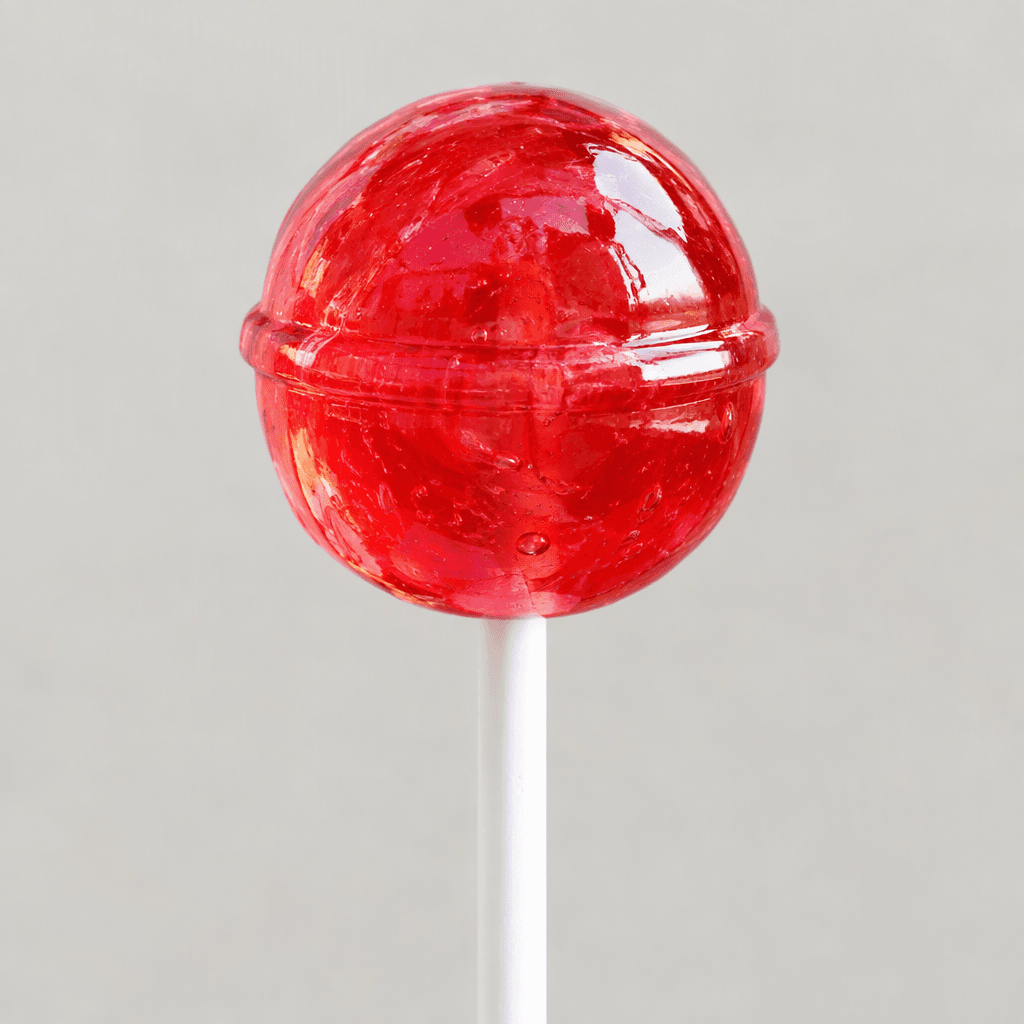 A brightly coloured, glossy hard candy in a round or playful shaped form, often translucent, mounted on a slender white stick.