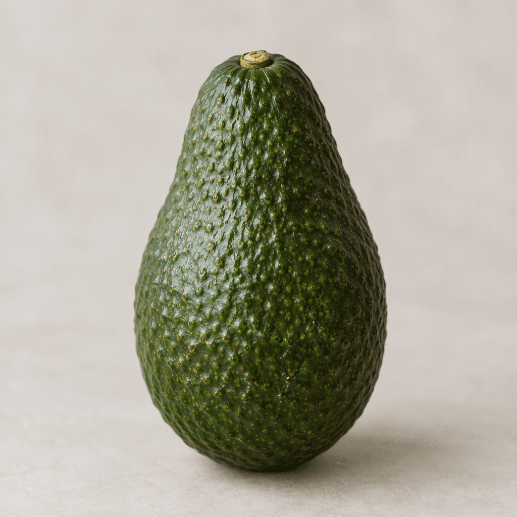A small, pear-shaped avocado with dark green, slightly pebbled skin and a gently tapered top, shown whole.