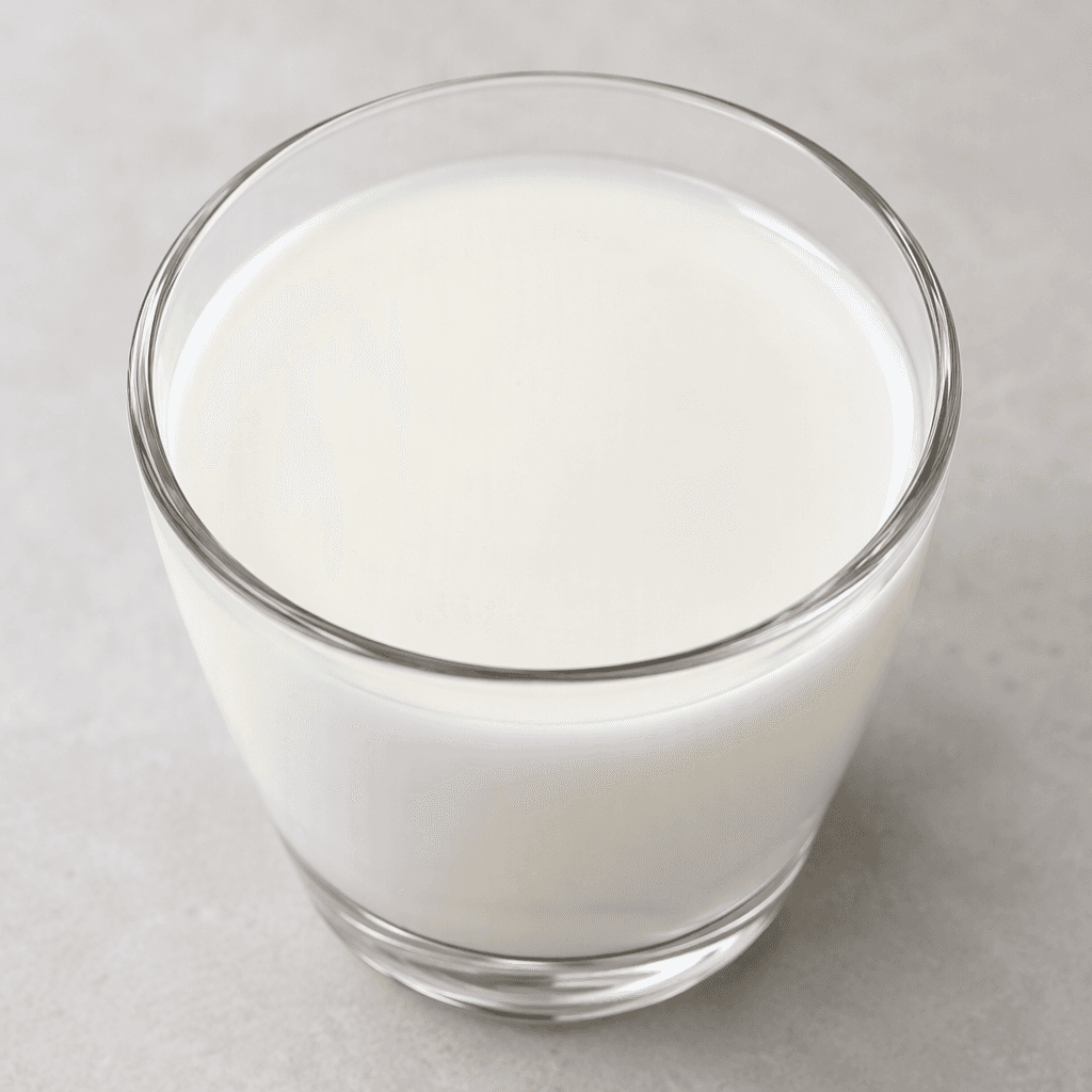 An opaque, creamy-white liquid with a smooth, even surface and a faint sheen.