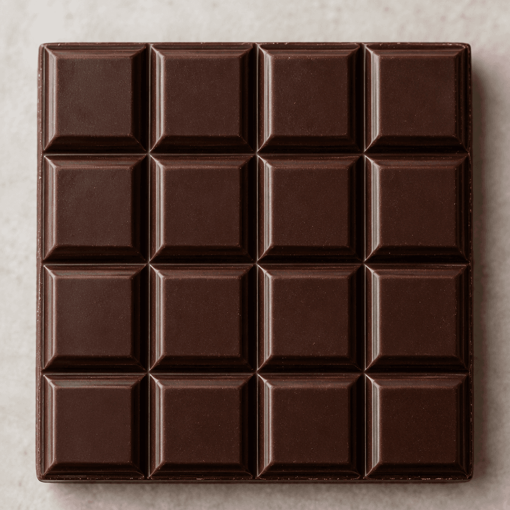 A deep brown dark chocolate bar with a smooth, faintly glossy surface, molded into neat rectangular segments.
