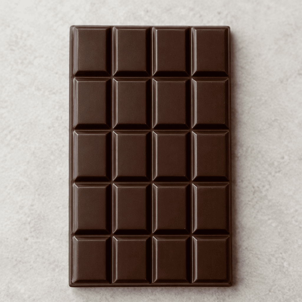 A smooth, deep-brown dark chocolate bar divided into neat rectangular sections, with a subtle sheen and clean edges.