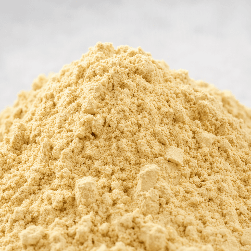 A mound of fine, light beige powder with a soft, slightly clumpy texture.
