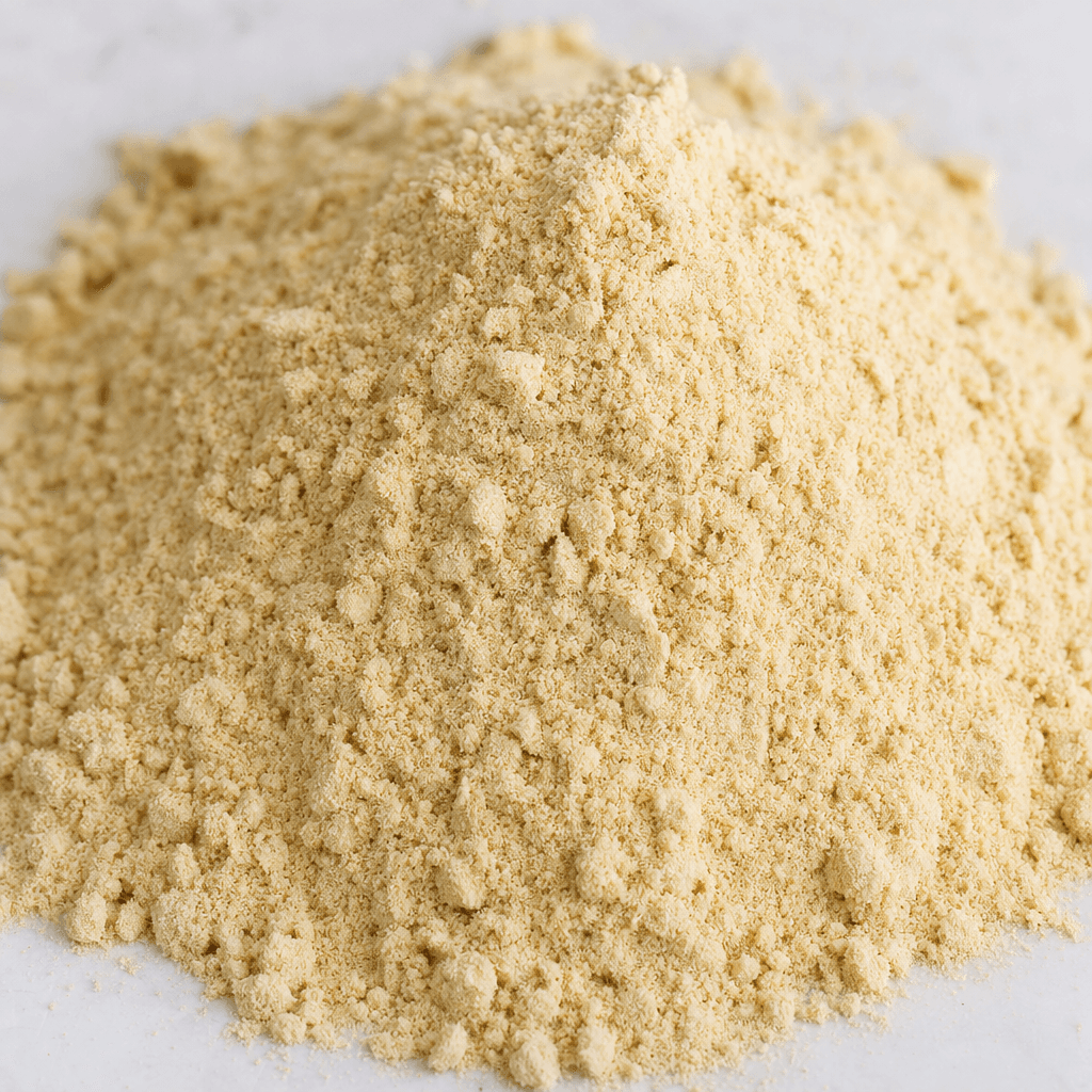 A loose, finely ground pale beige powder with a soft, slightly clumpy texture.