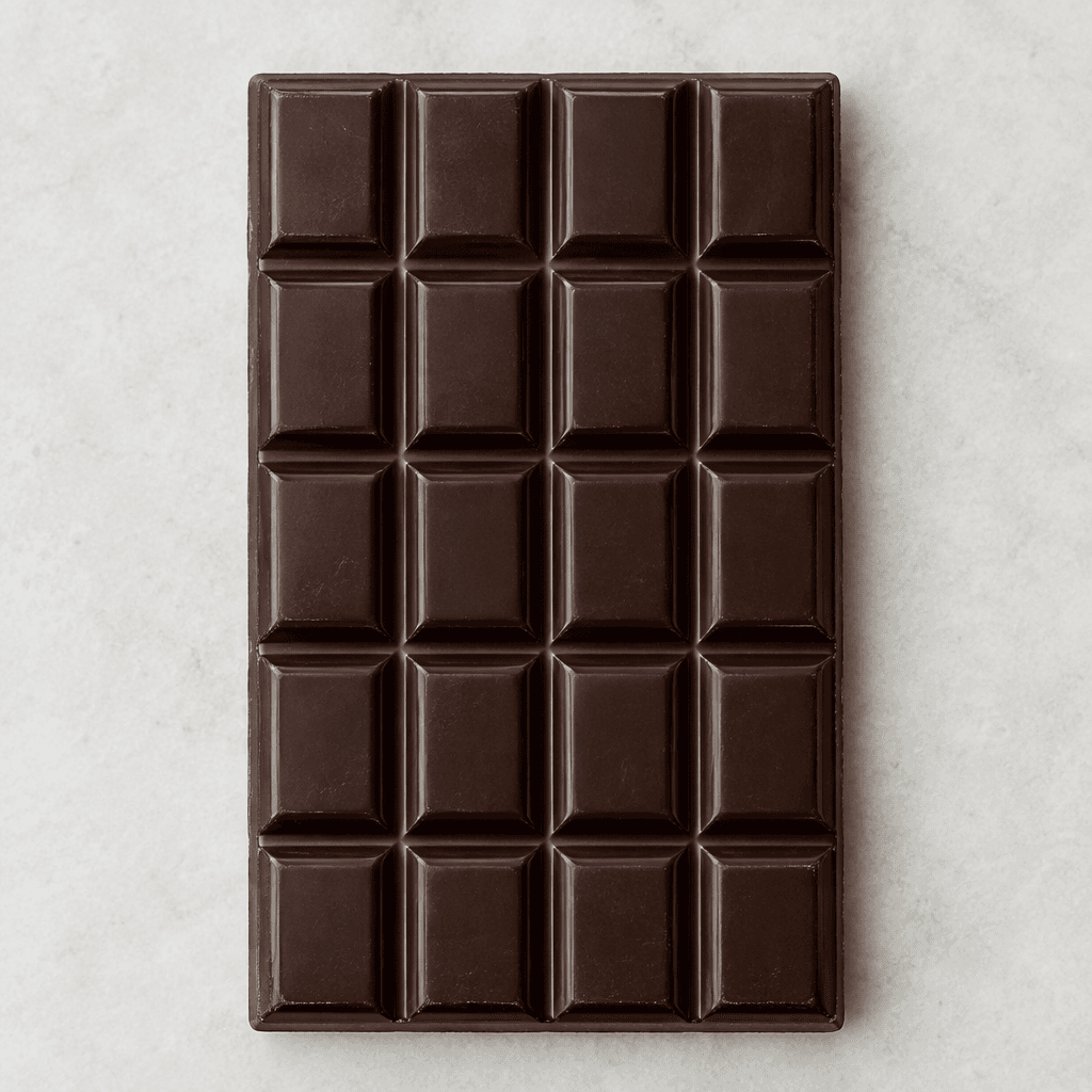 A deep brown, rectangular dark chocolate bar with a smooth, slightly glossy surface divided into neat raised segments.
