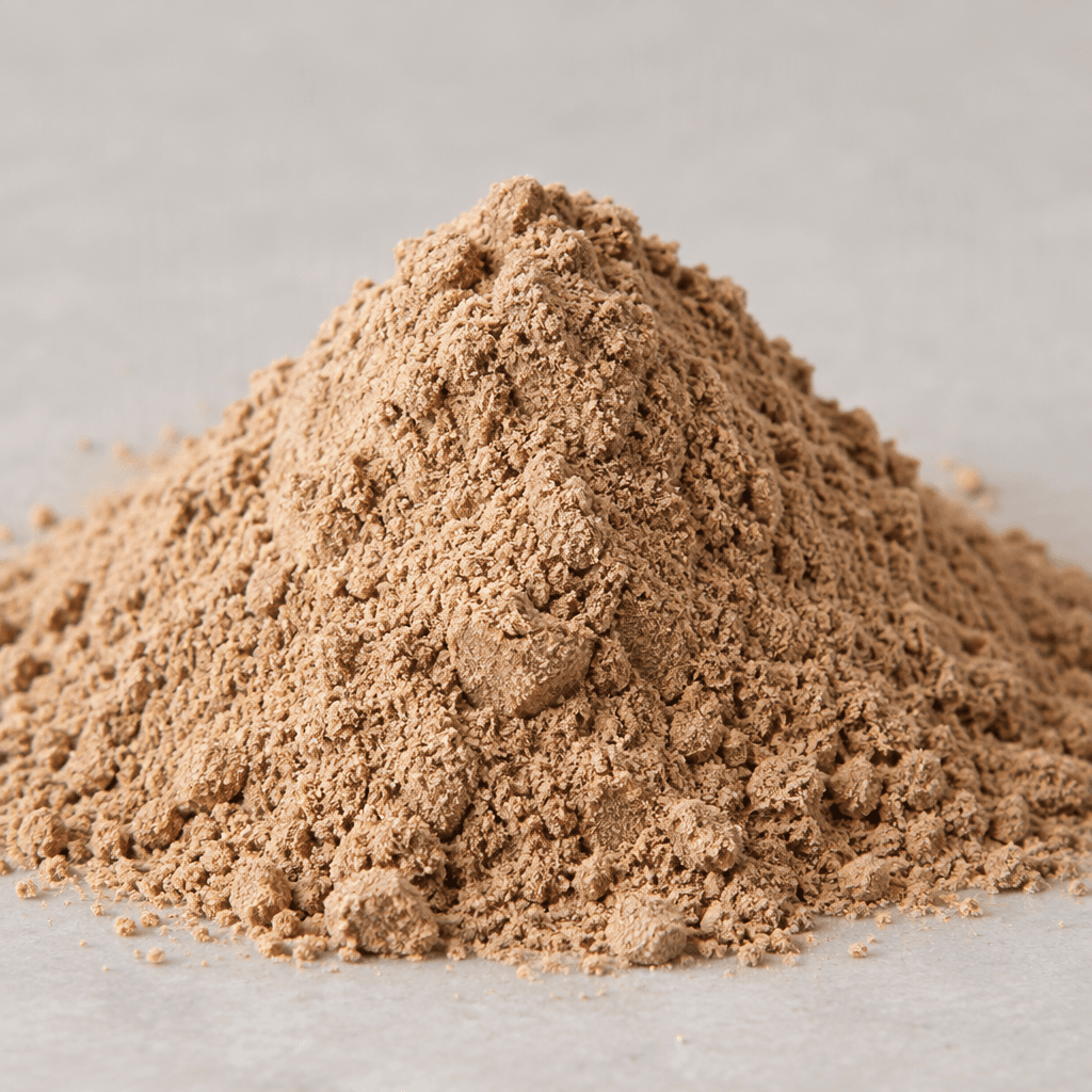 A mound of fine, light-brown protein powder with a dry, softly granular texture.